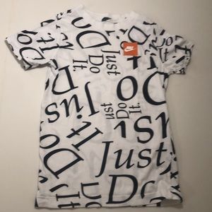 White Nike tee with words all over